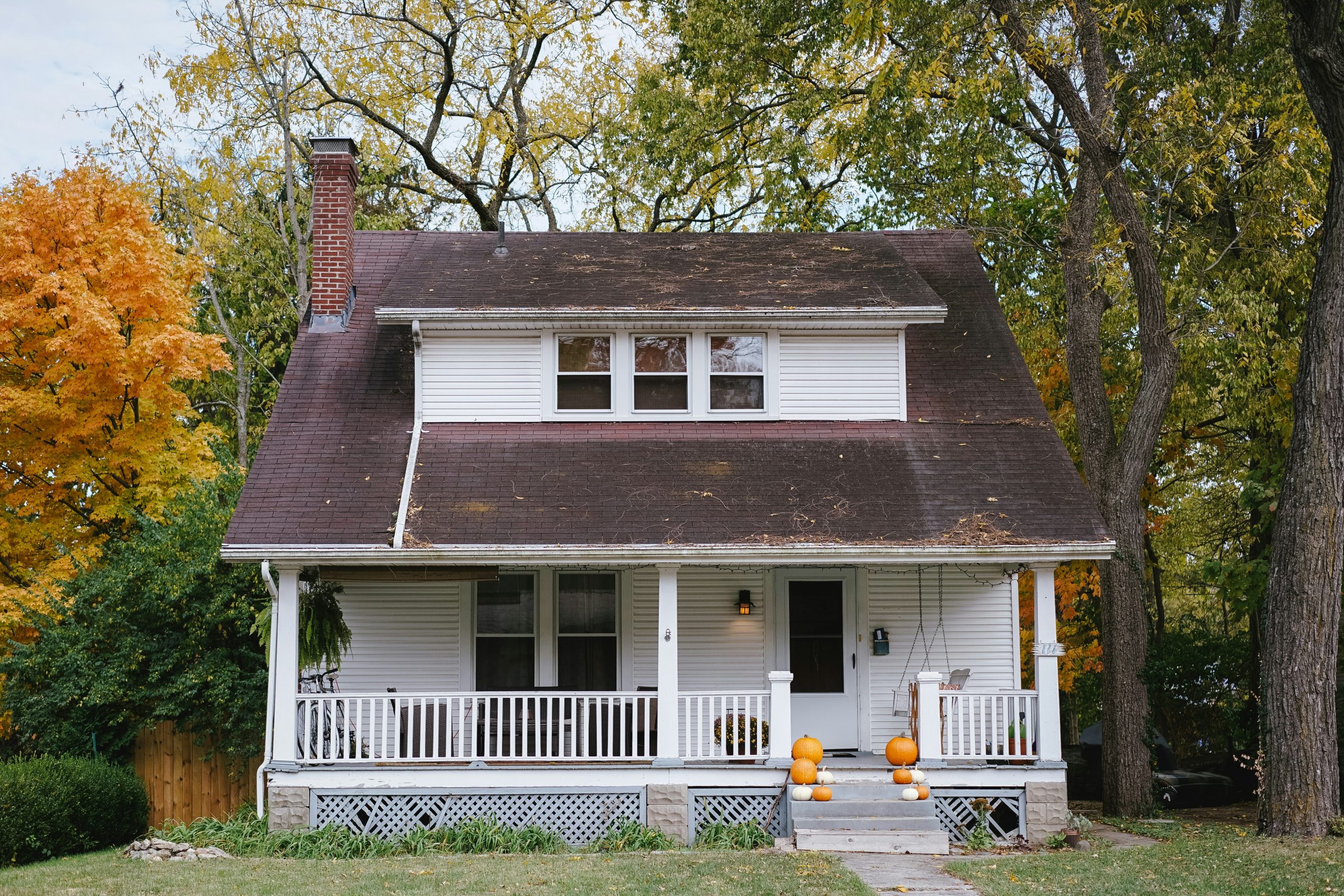 Image of a roof being inspected for damage, showcasing C&B Roofing LLC's repair and maintenance services.